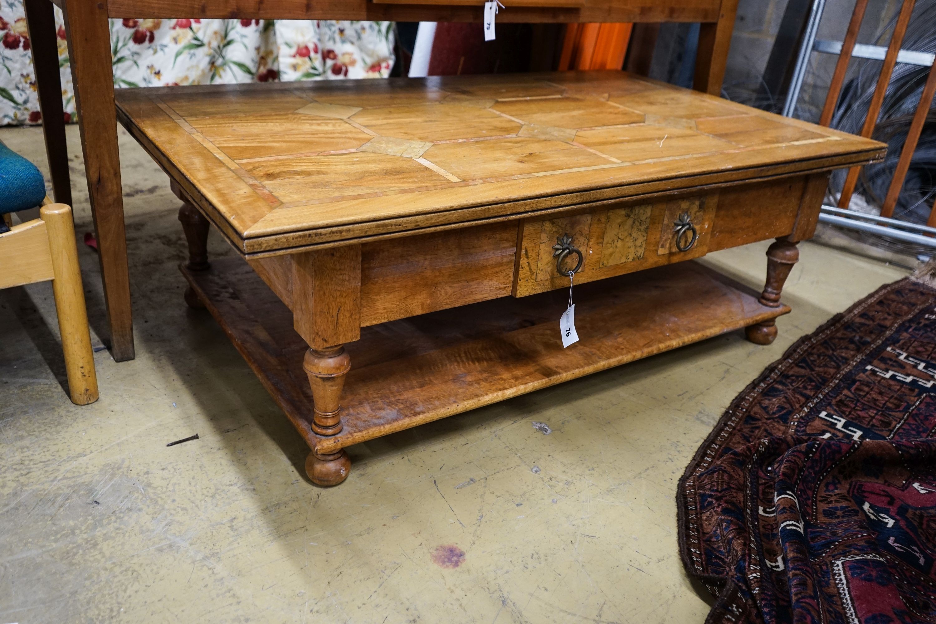 A rectangular parquetry inlaid walnut two tier coffee table, length 130cm, depth 80cm, height 45cm